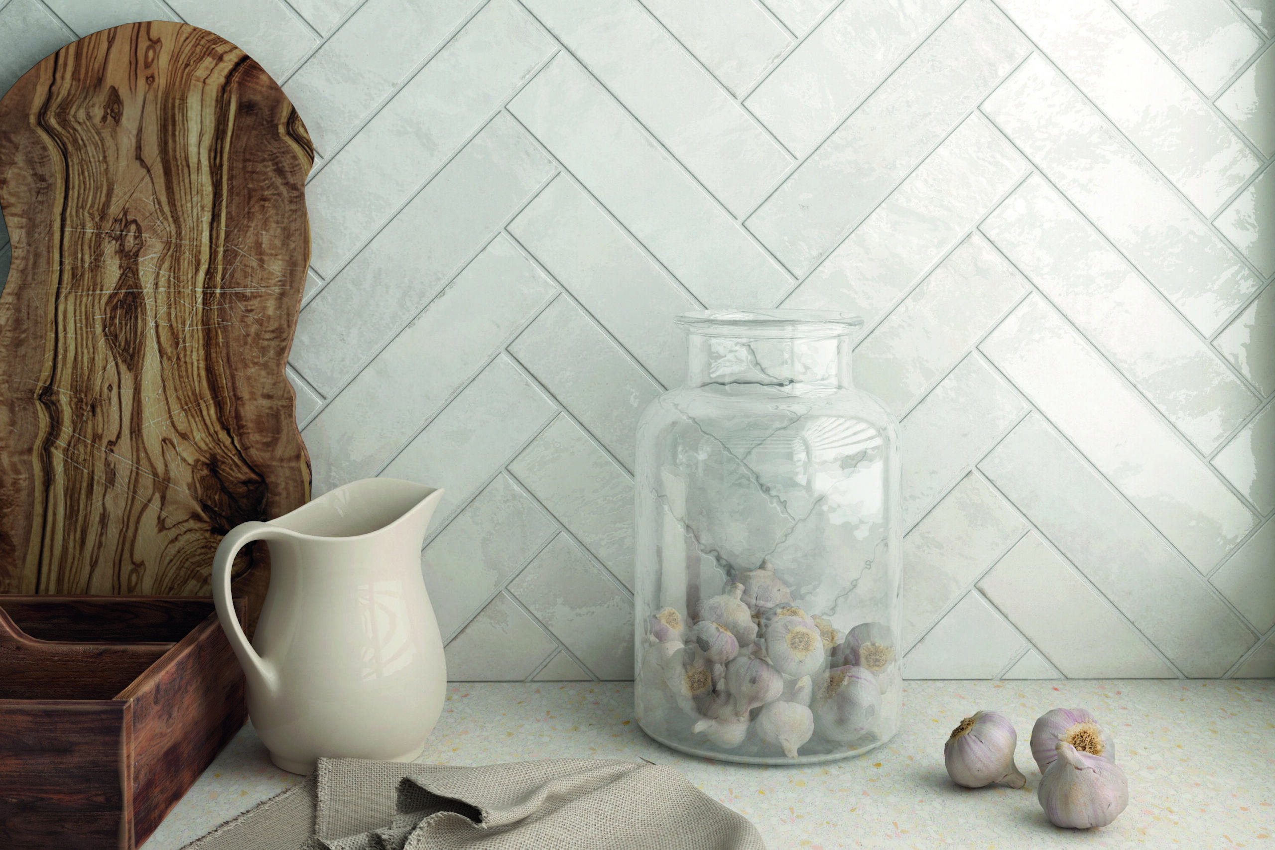 A white handmade-look subway tile backsplash.