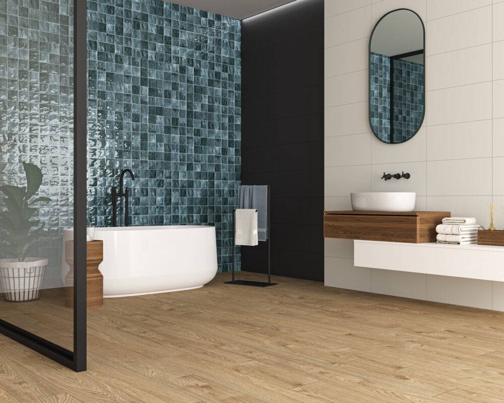 This large modern bathroom features a blue handmade-look accent wall.