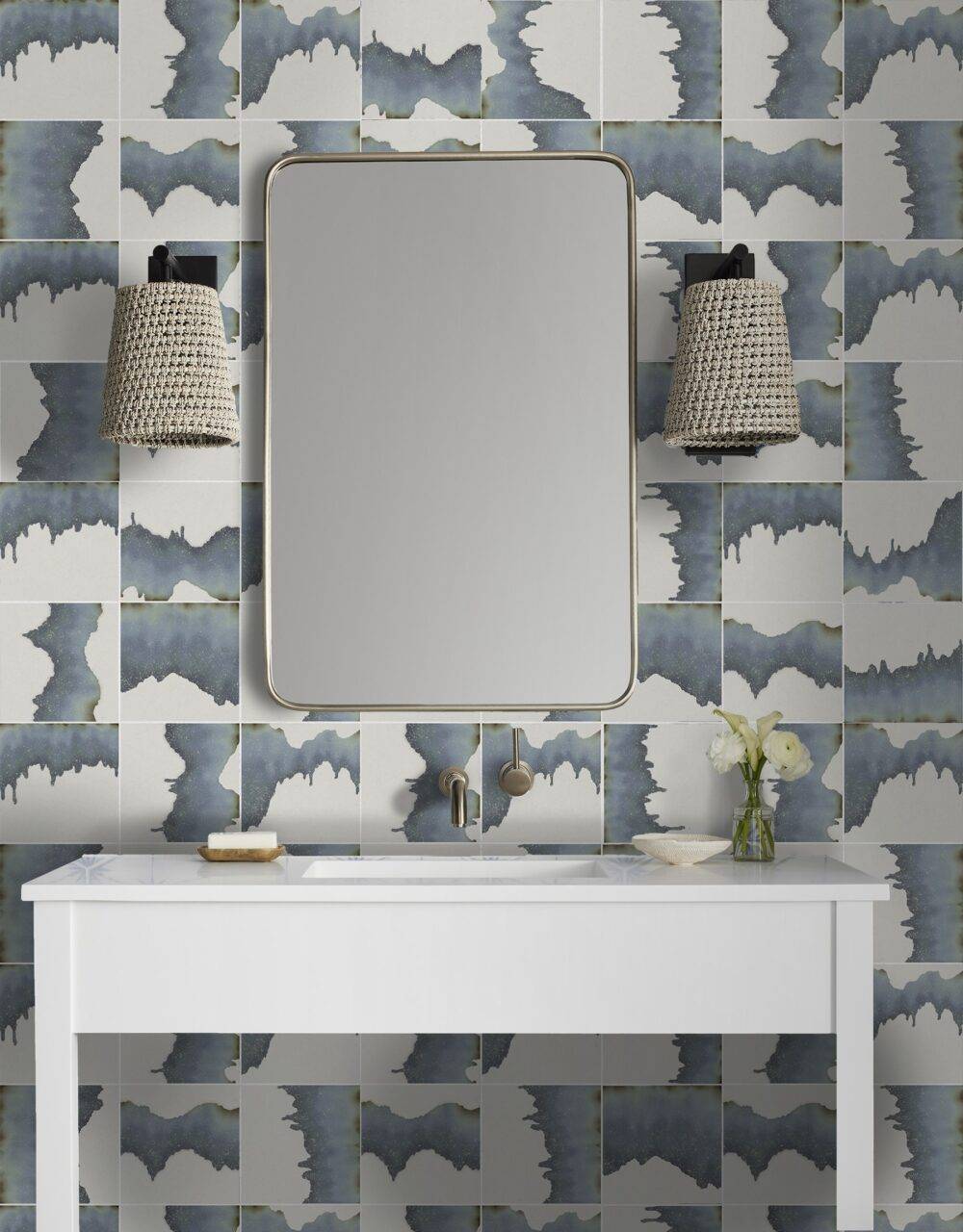 A coastal chic bathroom vanity with abstract blue tile.