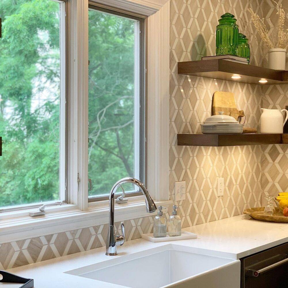 This elegant kitchen backsplash features a diamond-shaped travertine tile.